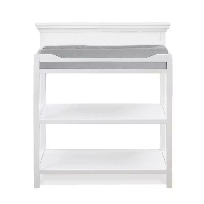 Table à langer universelle avec finition non toxique et étagères ouvertes, design de transition
