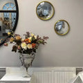 Miroir convexe doré avec cadre en métal, accent mural décoratif pour salon ou entrée, petite ou moyenne taille