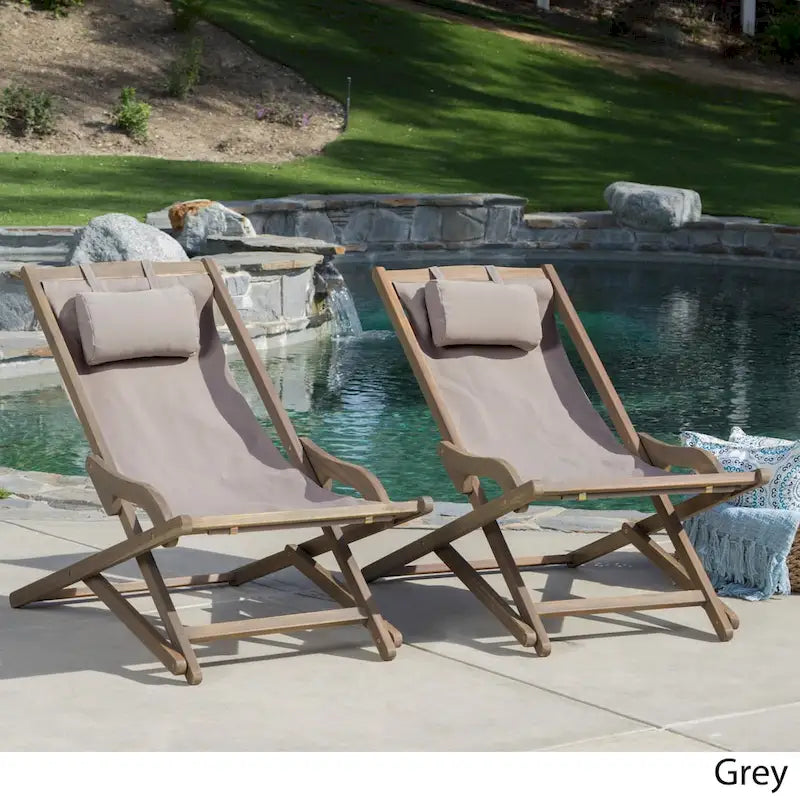 Chaises longues pliantes d'extérieur Nikki en bois d'eucalyptus et toile (lot de 2) par Christopher Knight Home