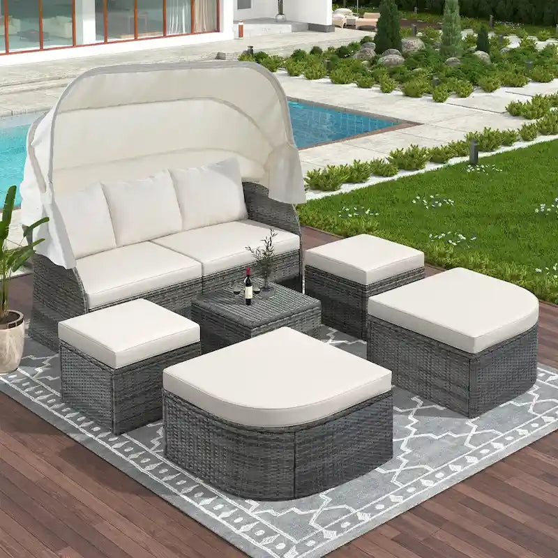 Bain de soleil d'extérieur en osier gris avec coussins et auvent rétractable